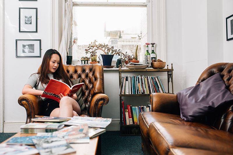 female student reading in Seamus Heaney Centre