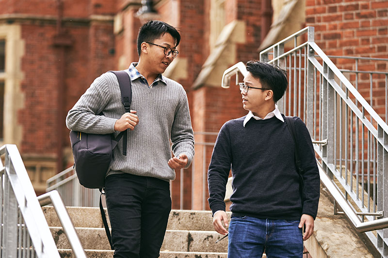 Students walking down steps at Riddel Hall