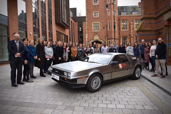 Delorean surrounded by Queen's staff