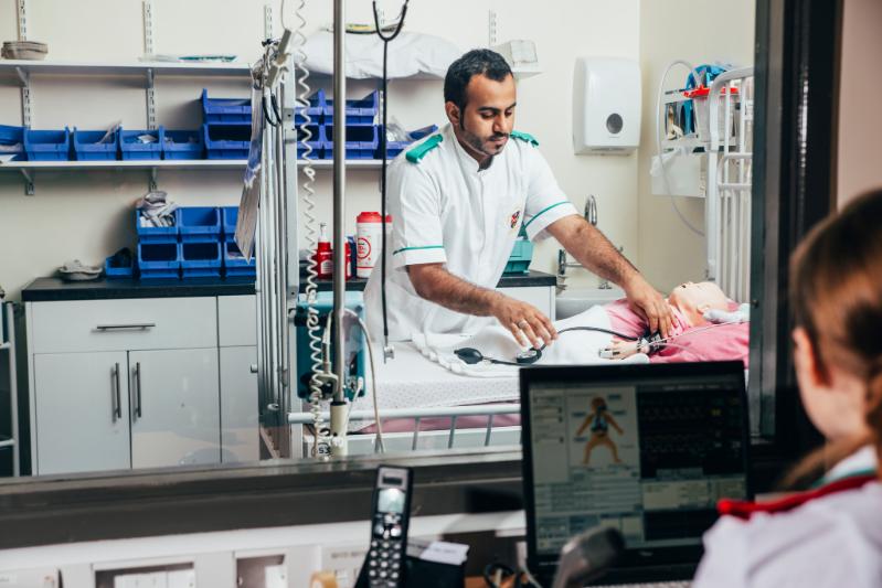 Male student doing SIM