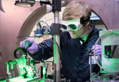 PhD student using lasers