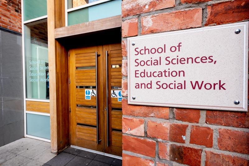 close up of the front door and signage of 6 College Park building