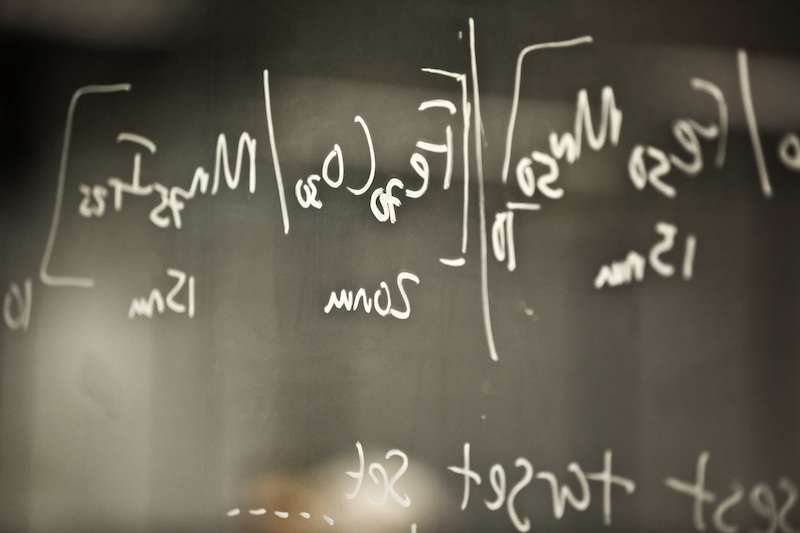 Physics equations on a blackboard