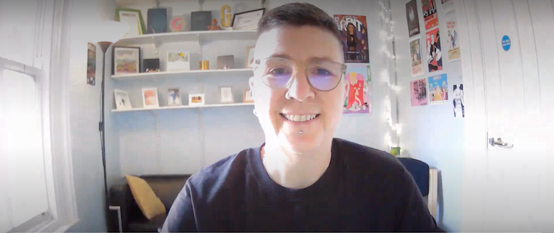 Woman with short hair and glasses