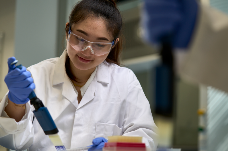 A biomedical sciences student working with samples