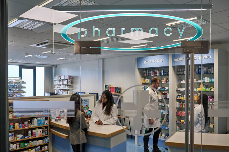 Students studying in a pharmacy shop
