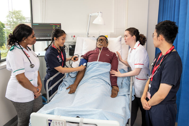 Healthcare students undertaking a simulated interview with a patient
