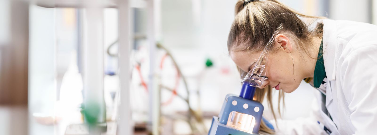 Student using a microscope