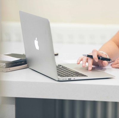 Hidden user with laptop