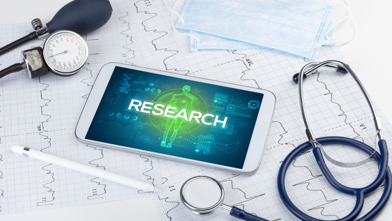 Image on smartphone reads Research