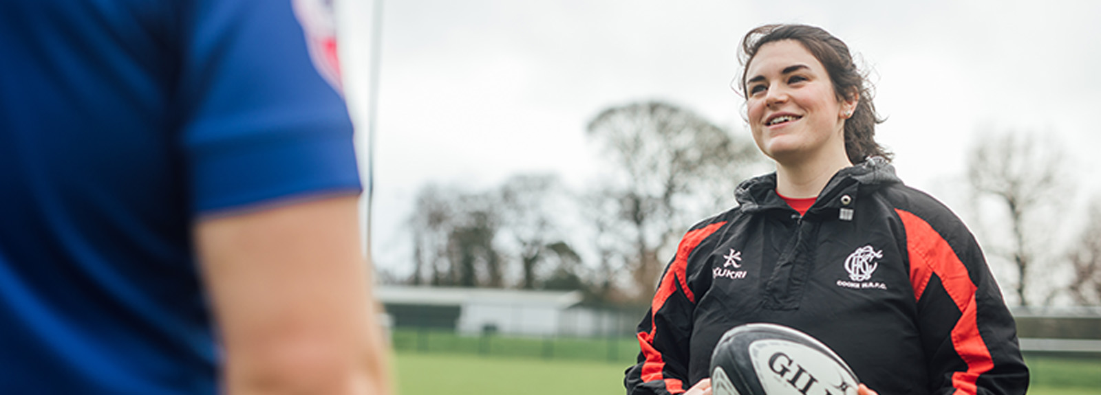 Image of staff member with Rugby Ball