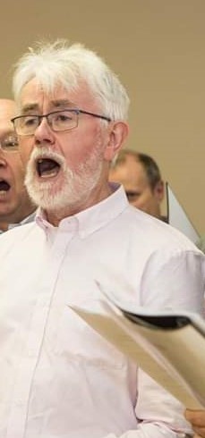 Paddy singing in Staff Wellbeing choir, 2018