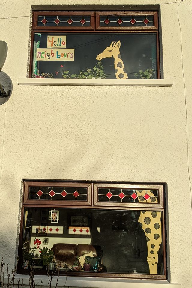 Image of a giraffe painting on a window