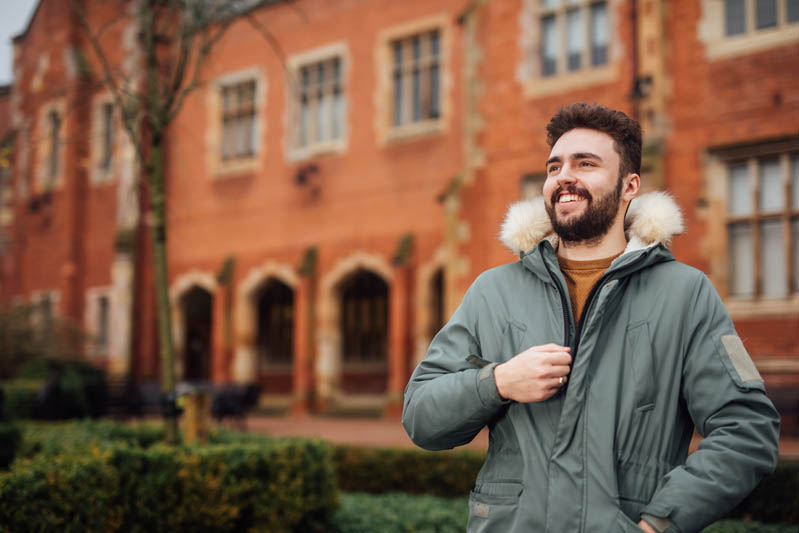 Image of student in quad with coat