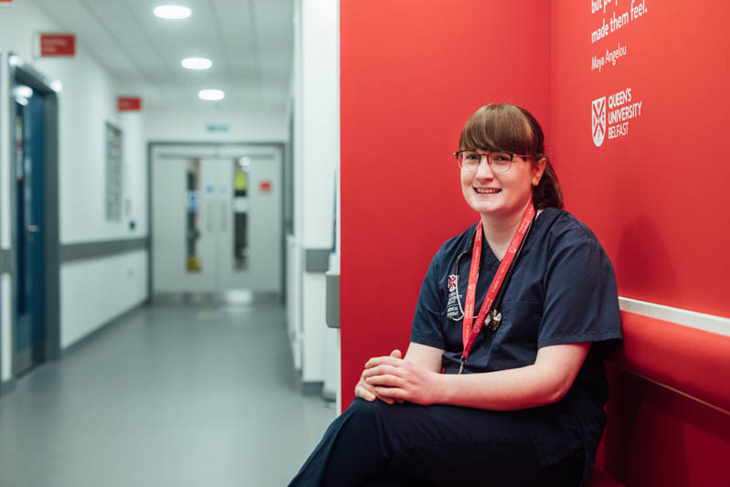 Image of student sitting on a sofa in the InterSim Centre