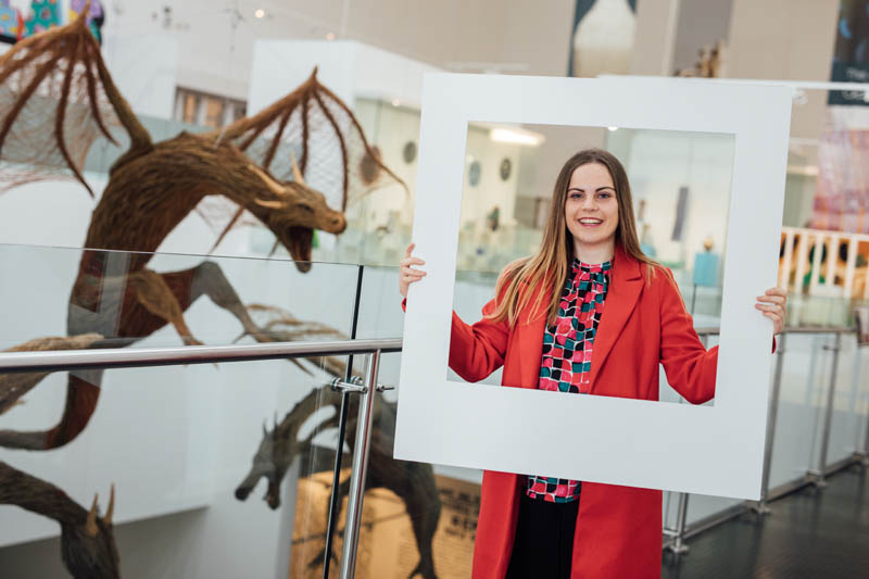 Image of student in the Ulster Museum with large polaroid frame