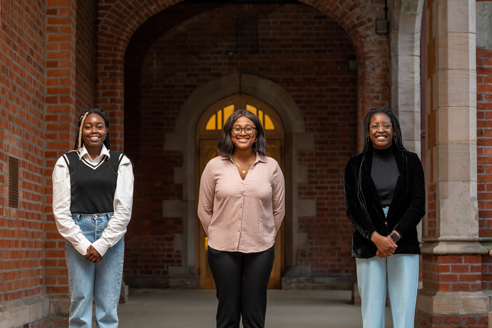 three students in QUB quadrangle for Black History Month 2021