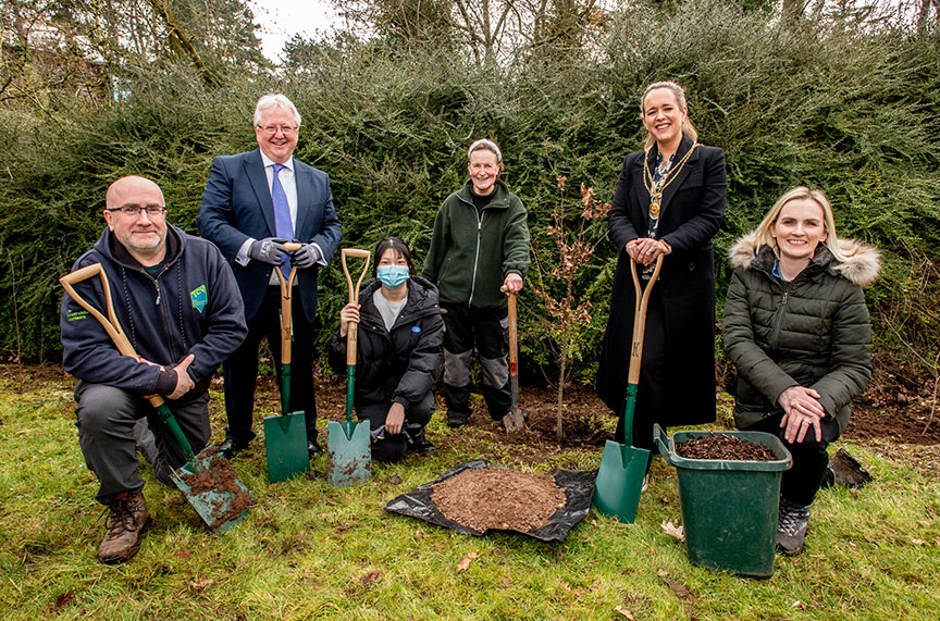 Planting saplings at Elms Village (l-r): Conservation Volunteer Chris Wood, Professor Michael Alcorn, Dean of Internationalisation at Queen’s, Queen’s student and volunteer Zixin Zheng, Co-founder of the Tree Nursery Eileen Sung, Lord Mayor Cllr Kate Nicholl, and Head of Sustainability at Queen's University Sara Lynch