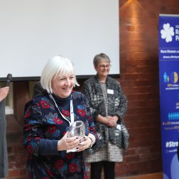 Fiona McLaughlin receiving crystal award