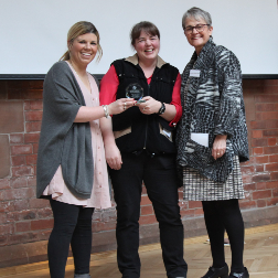 Dr. Julie McMullan, Prof. Amy Jayne McKnight receive crystal award from Baroness Ritchie