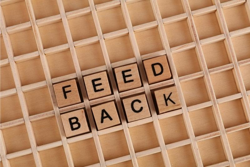 small wooden tiles spelling out 'Feed Back'