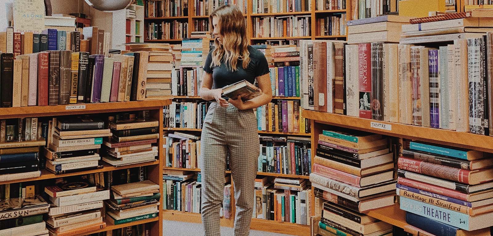 Woman walking through a bookshop
