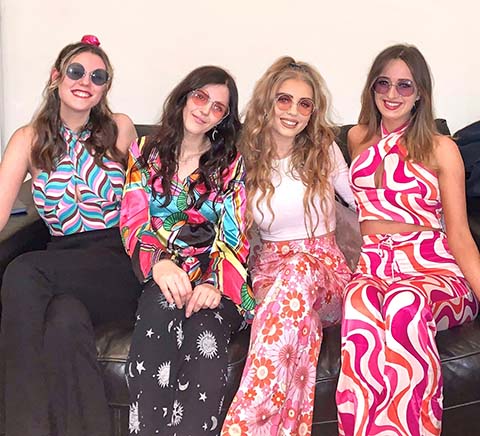Claire and friends dressed as hippies