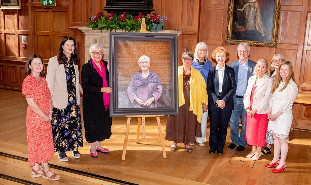 group photo at Carol McGuinness portrait unveiling