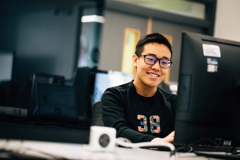 A student working on a computer.