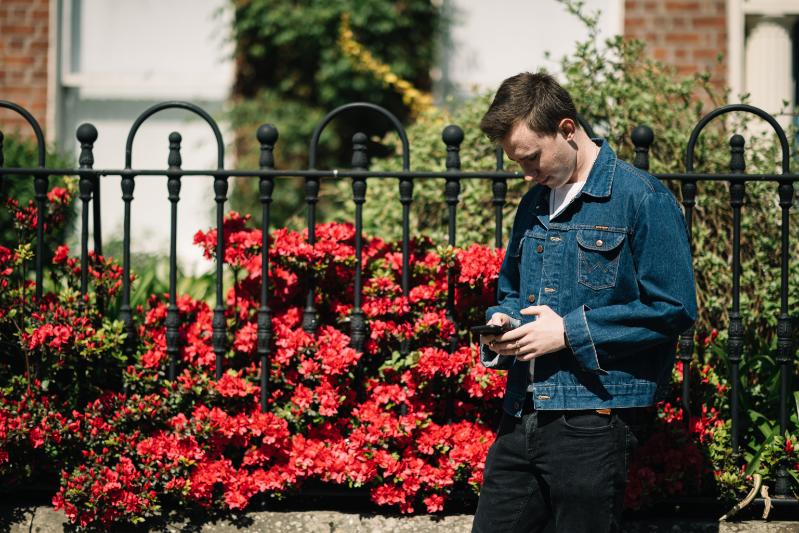 A student looking at their mobile phone.