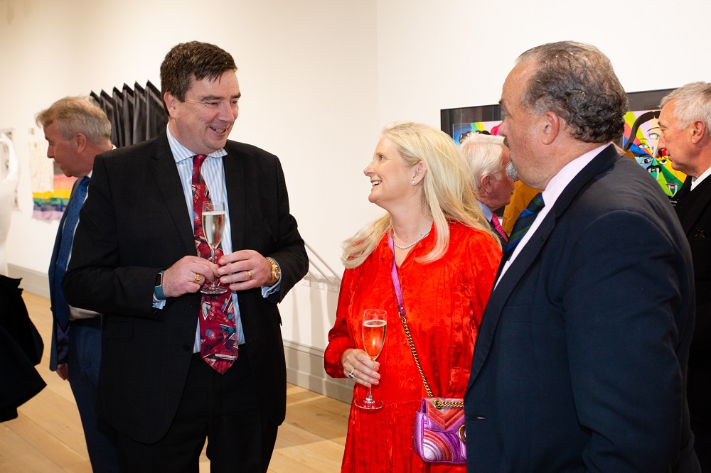 Donogh Lysaght talking with Deirdre Naughton and guest at NGXX, the Naughton Gallery's 20th anniversary exhibition