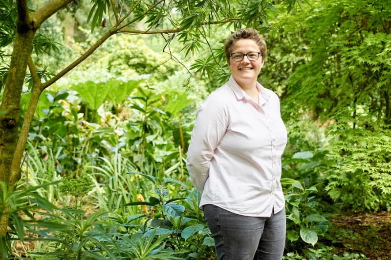 Professor Ruth Hunter surrounded by vegetation
