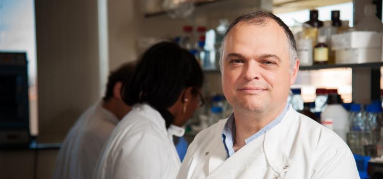 Professor Jose Bengoechea in white lab coat