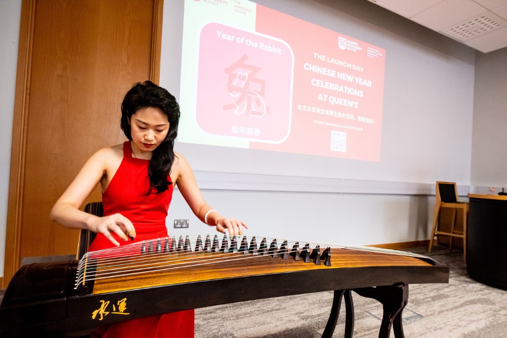 Queen's graduate playing guzheng