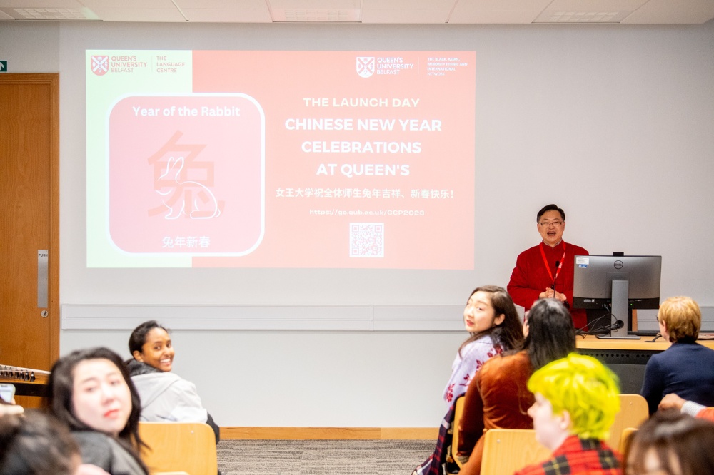 Liang Wang welcoming staff and students to Queen's CNY celebrations