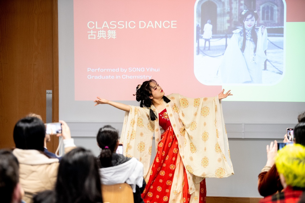 student or graduate performing classical Chinese dance at the CNY celebrations