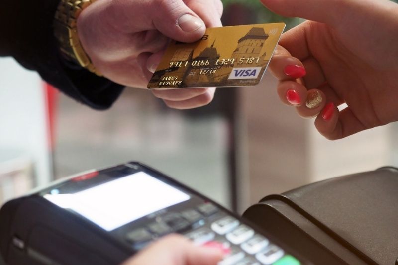 Image shows a card transaction taking place
