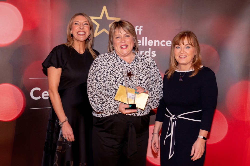 Maria Carrick - Outstanding Contribution Award winner, with compere Alexandra Ford and Mairead Regan, Chair of the Staff Excellence Awards Judging Panel