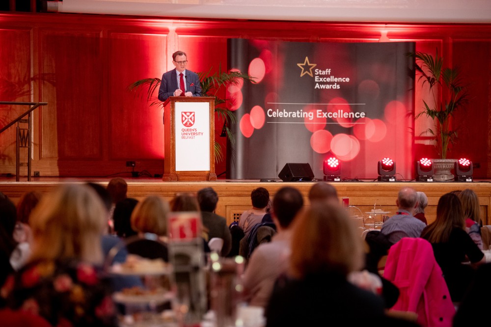 Vice-Chancellor Professor Ian Greer addressing guests from the Whitla Hall stage at the Staff Excellence Awards 2022