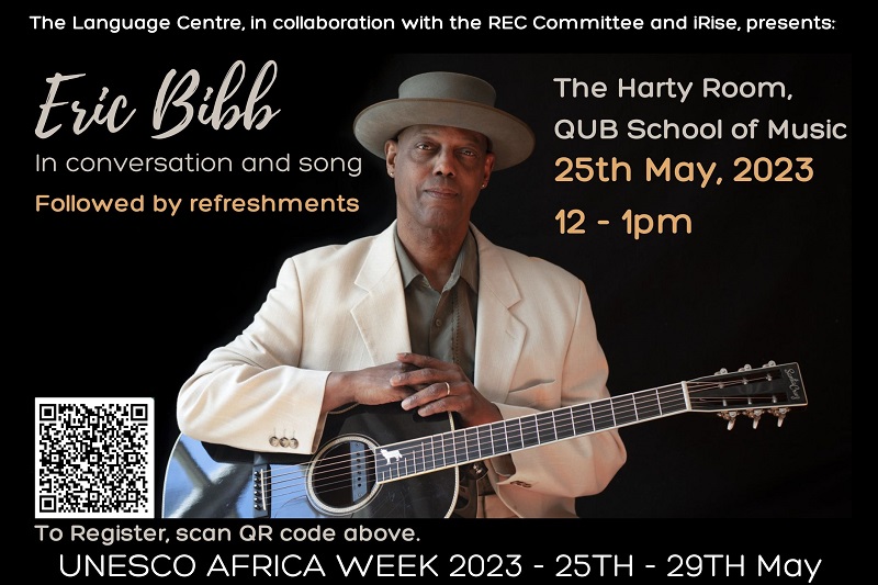 Eric Bibb in conversation and song, 25 May 2023, Queen's University Belfast - image shows Eric holding a guitar