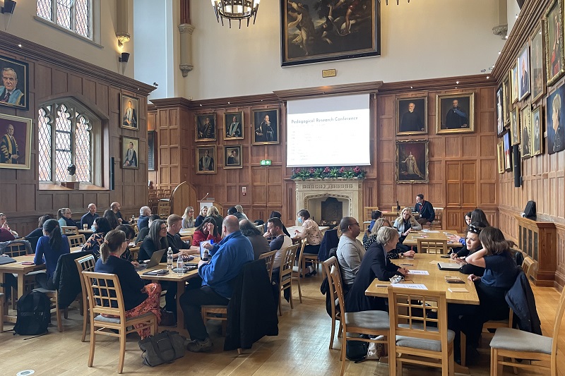 Queen's staff seated at a workshop in the Great Hall
