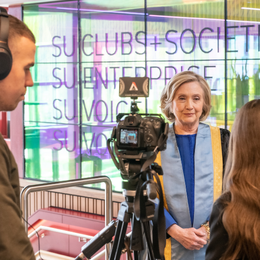 Queen's Chancellor, Secretary Hillary Rodham Clinton, being filmed at the University's Agreement 25 Conference in April 2023