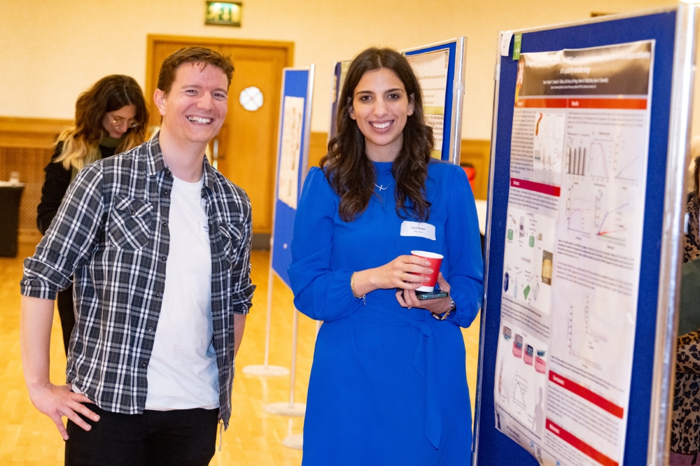 two smiling postdocs at the poster presentation at Queen's Postdoc Showcase 2023