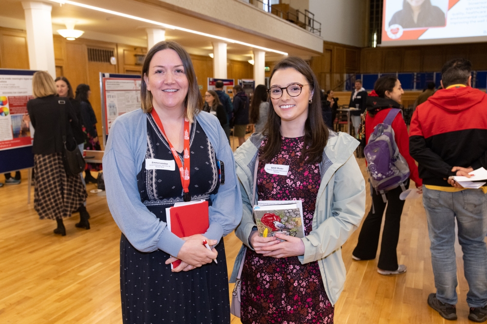 two smiling postdocs at the poster presentation at Queen's Postdoc Showcase 2023