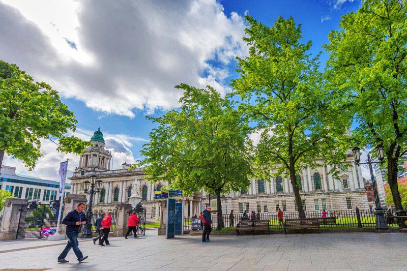 Belfast city hall through the trees