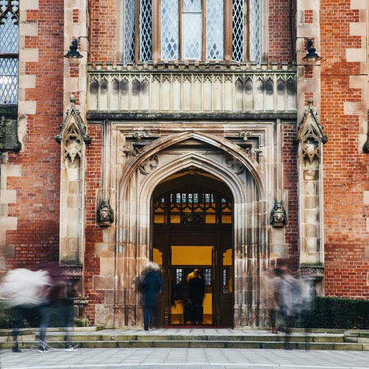 Students walking through the main entrance to the Lanyon Building