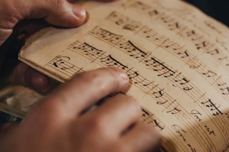 close up of an old book of sheet music
