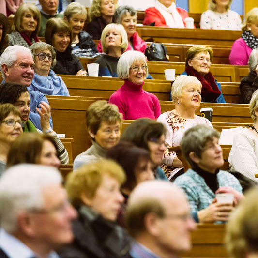 Open Learning students attending a World Literature lecture in a tiered lecture theatre