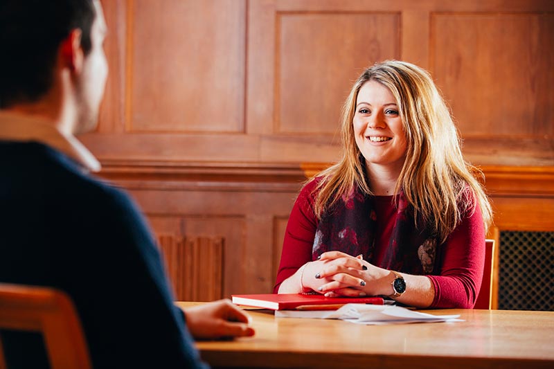 Female student in conversation with male student