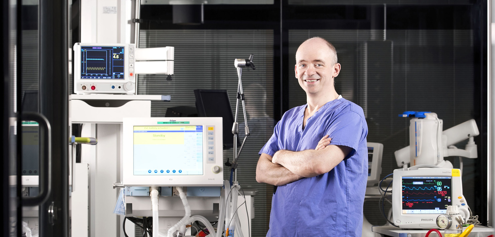 Professor Danny McAuley in scrubs in lab 